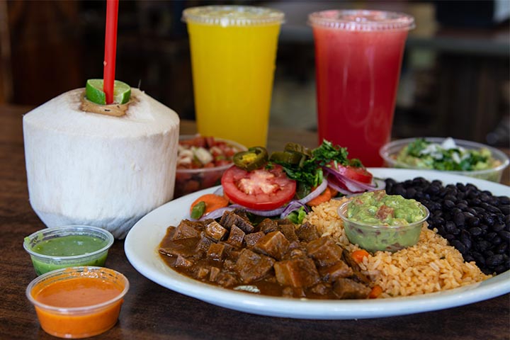 Mexican Carnitas with sandia and coconut juices.