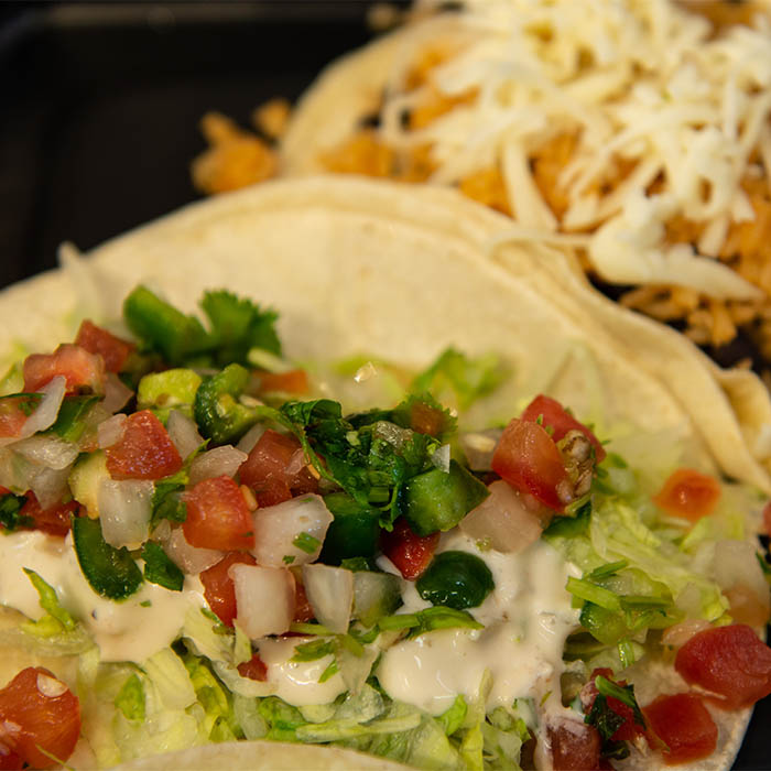 fresh tacos with cream and salsa from a top Taqueria in San Francisco