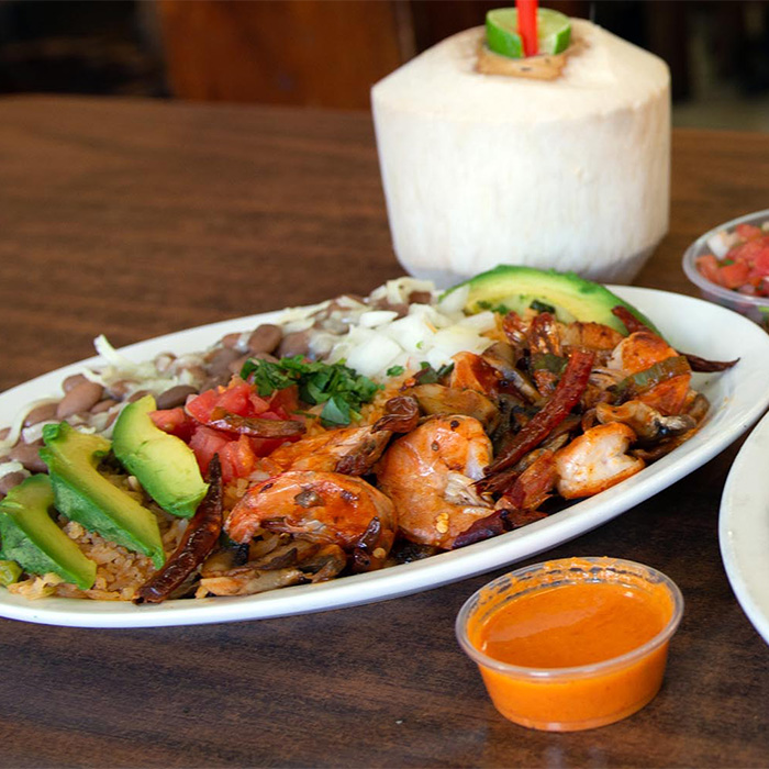 Shrimps, camarones platter with chiles, garlic and avocado.